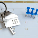 high angle view thumbtacks key calendar