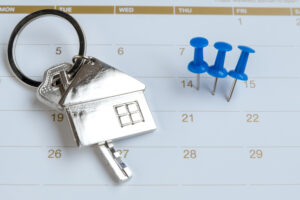 high angle view thumbtacks key calendar